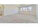 Spacious main bedroom with neutral carpet, recessed lighting, and multiple windows at 2968 S Poppy St, Morrison, CO 80465