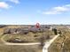 Aerial view of residential area near pond, path, and open space at 13181 Grant W Cir # B, Thornton, CO 80241