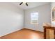 Bedroom with natural light, wood floors, and a window overlooking outdoors at 13181 Grant W Cir # B, Thornton, CO 80241