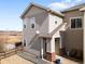 Charming two-story townhome featuring a cozy front porch and neutral siding, complemented by a well-kept outdoor space at 13181 Grant W Cir # B, Thornton, CO 80241