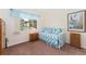 Bright bedroom with daybed, soft natural light, and neutral walls for a cozy atmosphere at 2239 Calais Dr # 11F, Longmont, CO 80504