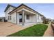This lovely home features a charming covered patio and a well-manicured lawn at 6616 N Nepal St, Aurora, CO 80019