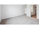 Neutral bedroom with plush carpet, white walls, and an en-suite bath at 6616 N Nepal St, Aurora, CO 80019