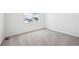 Neutrally decorated bedroom with carpet, baseboards, and a window view at 6616 N Nepal St, Aurora, CO 80019