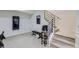 Basement exercise and stairwell area, featuring workout equipment and bench at 2214 Central Park Way, Superior, CO 80027