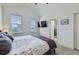Bright bedroom with a television, two windows and a ceiling fan at 2214 Central Park Way, Superior, CO 80027