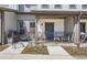 Charming front porch with a black metal fence and outdoor seating at 2214 Central Park Way, Superior, CO 80027