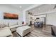 Open-concept living room flows into modern kitchen with island seating at 2214 Central Park Way, Superior, CO 80027