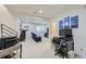 Basement living room features reclining loveseat, wet bar, stairs and a desk at 2214 Central Park Way, Superior, CO 80027