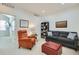 Upstairs living room featuring a gray sofa, orange chair and a bookcase at 2214 Central Park Way, Superior, CO 80027