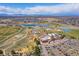 Aerial view of the community showcasing the beautiful recreation center with pool, tennis courts, playground, and walking trails at 10752 Steele St, Northglenn, CO 80233