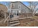 Multi-level deck with stairs leads to the large yard, offering the perfect place for barbecues and enjoying the outdoors at 10752 Steele St, Northglenn, CO 80233