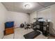 Unfinished basement featuring a window, a desk, a chair, and a treadmill at 10752 Steele St, Northglenn, CO 80233