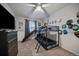 bedroom with a bunk bed with slide, TV, and white walls at 10752 Steele St, Northglenn, CO 80233