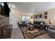 Comfortable living room featuring plush seating, a large rug, and ample natural light at 10752 Steele St, Northglenn, CO 80233