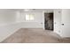 A spacious unfinished basement with neutral carpeting, and a closed door at 1140 Devonshire Ct, Lafayette, CO 80026