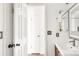 Bright bathroom with a modern vanity and a doorway leading to an adjacent room at 1140 Devonshire Ct, Lafayette, CO 80026