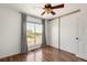 Bright bedroom with a large window, built-in closet, and scenic outdoor views at 1140 Devonshire Ct, Lafayette, CO 80026