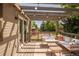 Outdoor deck area with string lights and comfortable seating overlooking a nearby playground at 1140 Devonshire Ct, Lafayette, CO 80026