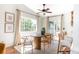 Dining area with modern wood table, neutral decor, and backyard access at 1140 Devonshire Ct, Lafayette, CO 80026