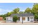 Street-level front of building with a motivational mural and white siding at 1140 Devonshire Ct, Lafayette, CO 80026