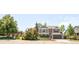 Suburban home near neighborhood park, with mature trees and a manicured front yard at 1140 Devonshire Ct, Lafayette, CO 80026