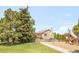 Back exterior view of the home with a deck and adjacent playground, perfect for families at 1140 Devonshire Ct, Lafayette, CO 80026