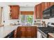Functional kitchen with granite counters, ample cabinet space and stainless appliances at 1140 Devonshire Ct, Lafayette, CO 80026
