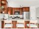 Kitchen with stainless appliances, island seating, and ample storage at 1140 Devonshire Ct, Lafayette, CO 80026