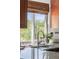 Kitchen sink with a view, granite countertops, and neutral color scheme at 1140 Devonshire Ct, Lafayette, CO 80026