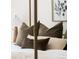Close up of a bed with decorative pillows and a framed wall art piece at 1140 Devonshire Ct, Lafayette, CO 80026