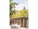 Scenic view from the deck showcasing lush trees and distant mountains, offering privacy at 1140 Devonshire Ct, Lafayette, CO 80026