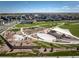 Aerial view of the community park, featuring an amphitheater, landscaping and walking paths at 3331 N Buchanan Way, Aurora, CO 80019