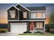 Charming two-story home with a brick facade, white garage door, and a welcoming red front door at 3331 N Buchanan Way, Aurora, CO 80019
