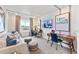 Versatile flex room with natural light, desk space, and comfortable seating at 3331 N Buchanan Way, Aurora, CO 80019