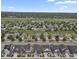 An aerial view of a well-planned neighborhood with manicured lawns and tree-lined streets in a suburban setting at 11151 W 53Rd Dr, Wheat Ridge, CO 80033