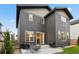 A well-maintained backyard featuring a patio with seating and a grill, perfect for outdoor entertaining at 11151 W 53Rd Dr, Wheat Ridge, CO 80033