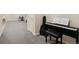 Finished basement area with gray carpet, piano, and ' play area at 11151 W 53Rd Dr, Wheat Ridge, CO 80033