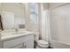 Bright bathroom with white fixtures, a tub-shower combination, and natural light at 11151 W 53Rd Dr, Wheat Ridge, CO 80033