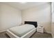 Neutral bedroom with a sleek bed frame and contemporary bedside tables at 11151 W 53Rd Dr, Wheat Ridge, CO 80033