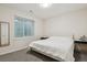 Cozy bedroom featuring soft natural light, neutral decor, and ample closet space at 11151 W 53Rd Dr, Wheat Ridge, CO 80033