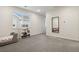 Cozy bedroom featuring a small bed, window with blinds, and a stylish mirror at 11151 W 53Rd Dr, Wheat Ridge, CO 80033