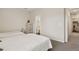 Well-lit bedroom featuring two twin beds and a glimpse into an ensuite bathroom at 11151 W 53Rd Dr, Wheat Ridge, CO 80033