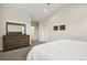 Spacious bedroom featuring a large dresser with mirror, and light-filled interior at 11151 W 53Rd Dr, Wheat Ridge, CO 80033