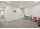 Bright living room with neutral walls, grey carpet, and ample storage space at 11151 W 53Rd Dr, Wheat Ridge, CO 80033