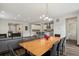 Open concept living space featuring a dining room and a modern kitchen with a kitchen island at 11151 W 53Rd Dr, Wheat Ridge, CO 80033