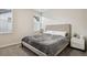 Comfortable bedroom with natural light, a queen-sized bed, and modern nightstands at 11151 W 53Rd Dr, Wheat Ridge, CO 80033