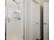 Modern bathroom featuring a glass-enclosed shower with chrome fixtures and tiled surround at 11151 W 53Rd Dr, Wheat Ridge, CO 80033