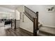 Elegant staircase with dark wood railings and carpeted steps at 11151 W 53Rd Dr, Wheat Ridge, CO 80033
