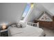 Bright attic bedroom featuring a large skylight and white walls at 1136 N Logan St # 8, Denver, CO 80203